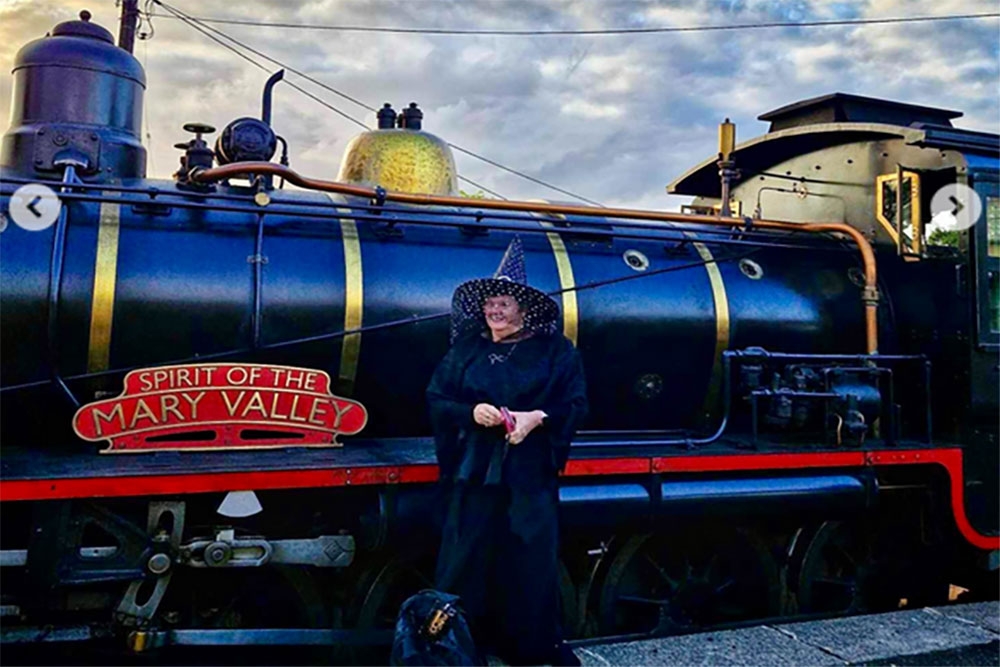 Person in costume standing near engine