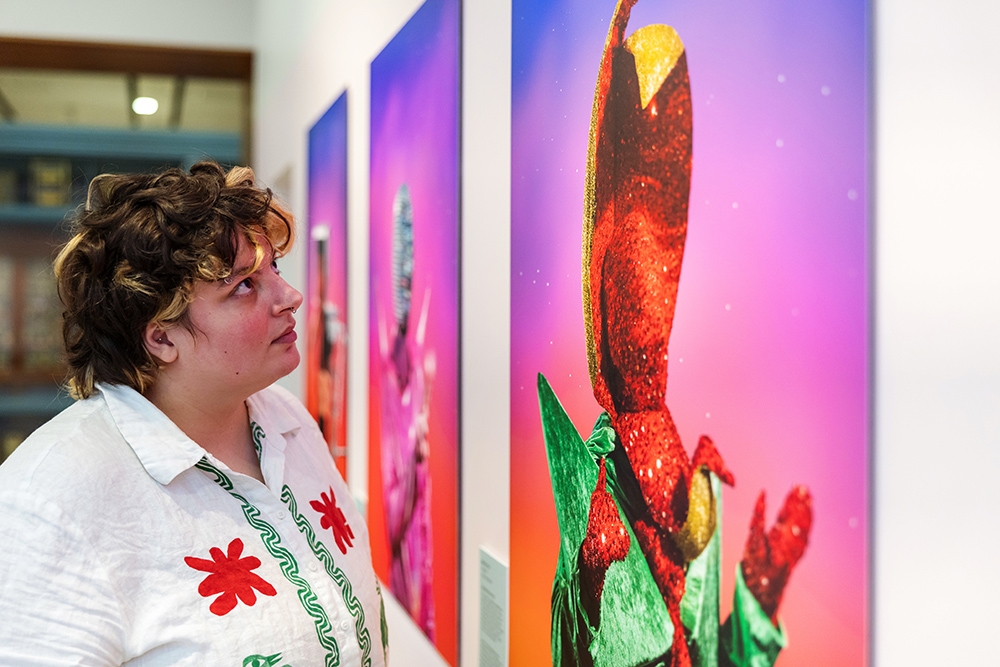 Person looking at art at Shimmer: An Artist in Residence project by Gerwyn Davies