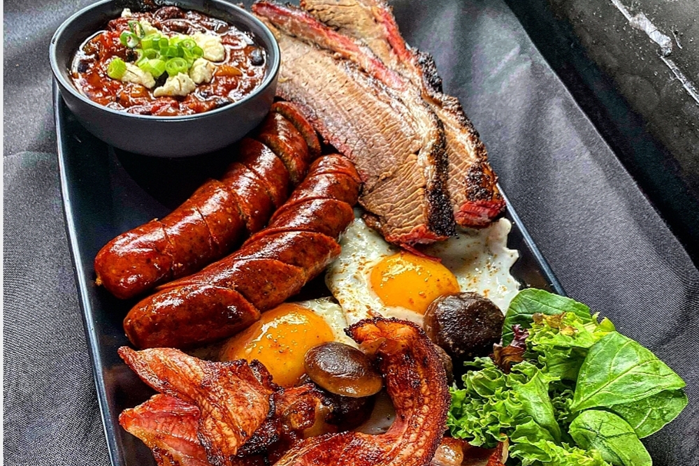 Smoked breakfast of meat and eggs on a plate at Phatboyz Walloon