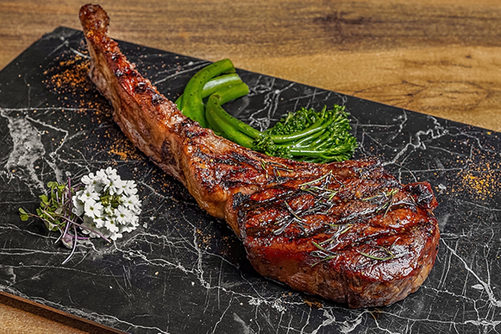 Premium, gold karat, black onyx and Wagyu/tomahawk on marble platter at Smokehouse Meat & Co South Bank