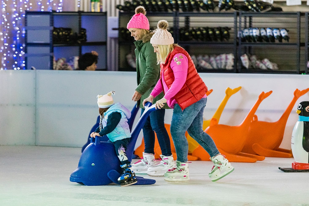 kid and parent on ice rink Snowflakes in Stanthorpe
