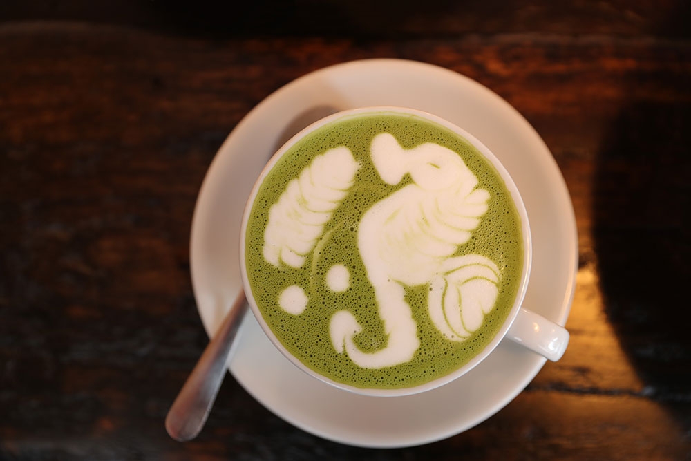 Mug of matcha at So What Stereo 