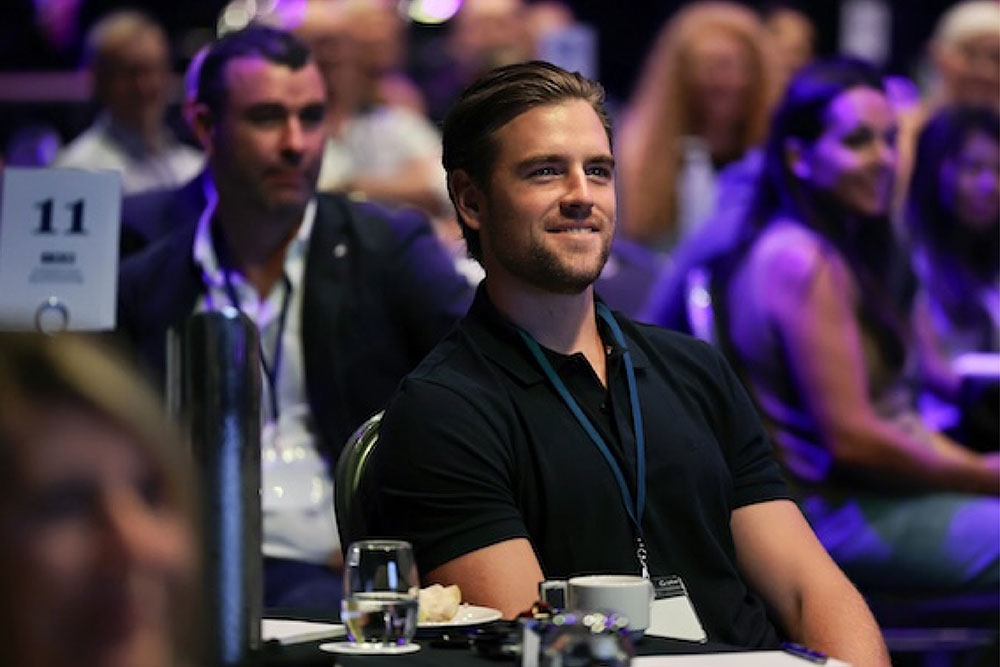 Man watching speaking at Thrive event