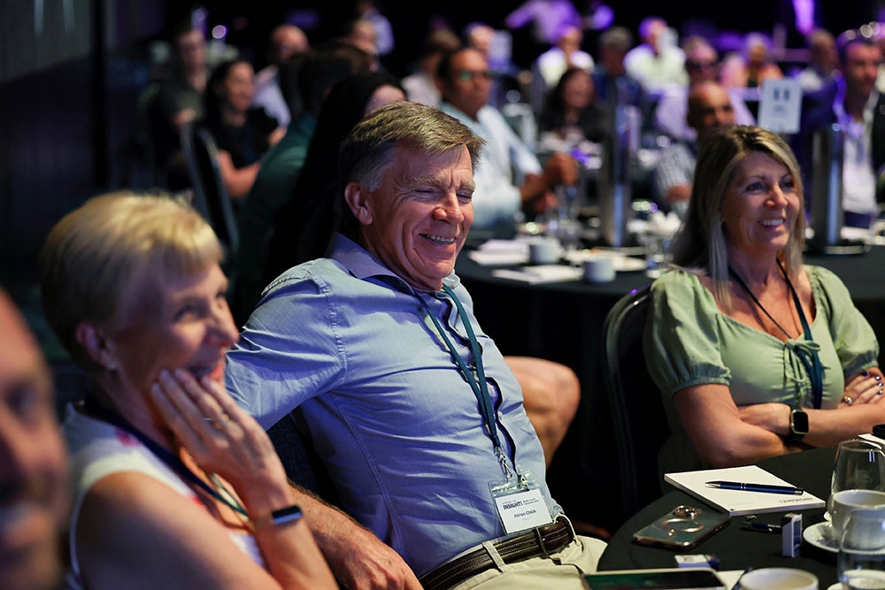 People sitting in audience listening to speakers