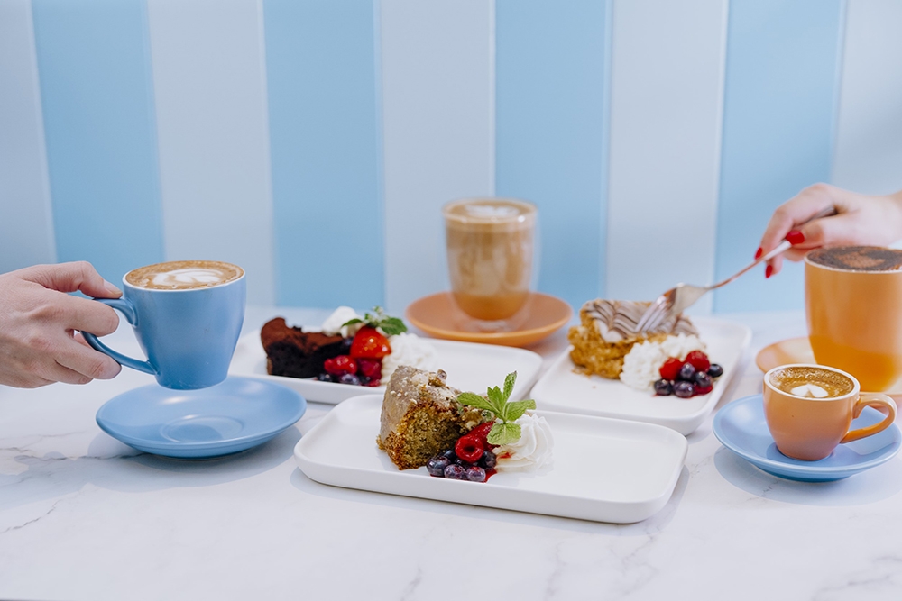 Coffees and desserts on a table at The Parlor The Glen Hotel Eight Mile Plains