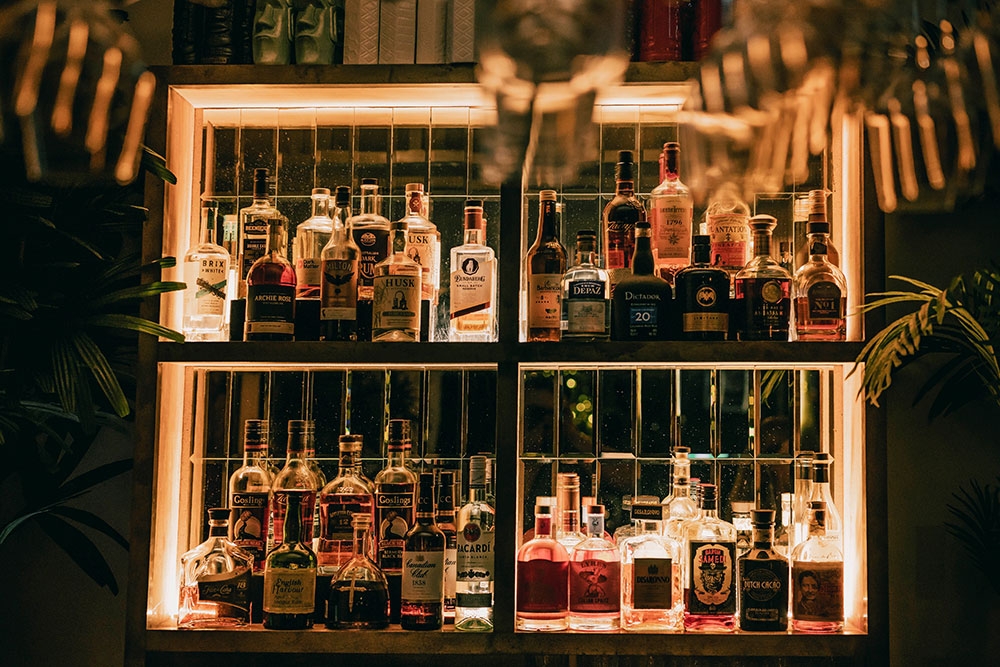 Bottles of alcohol on shelves on the wall at The Tailors Woolloongabba