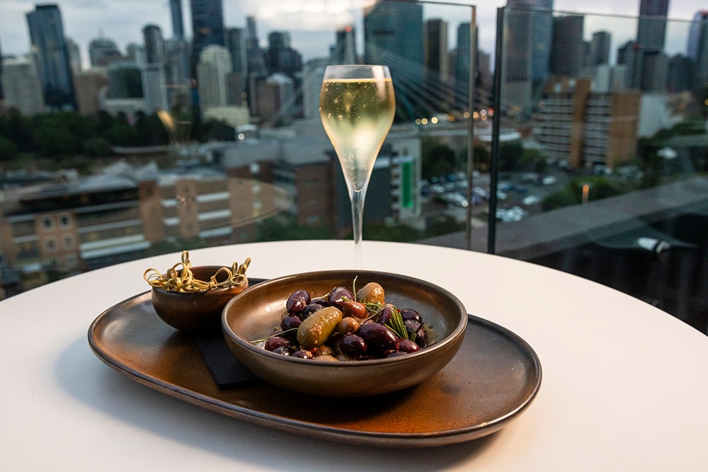 Plate of food & glass of wine at Eagles Nest Kangaroo Point