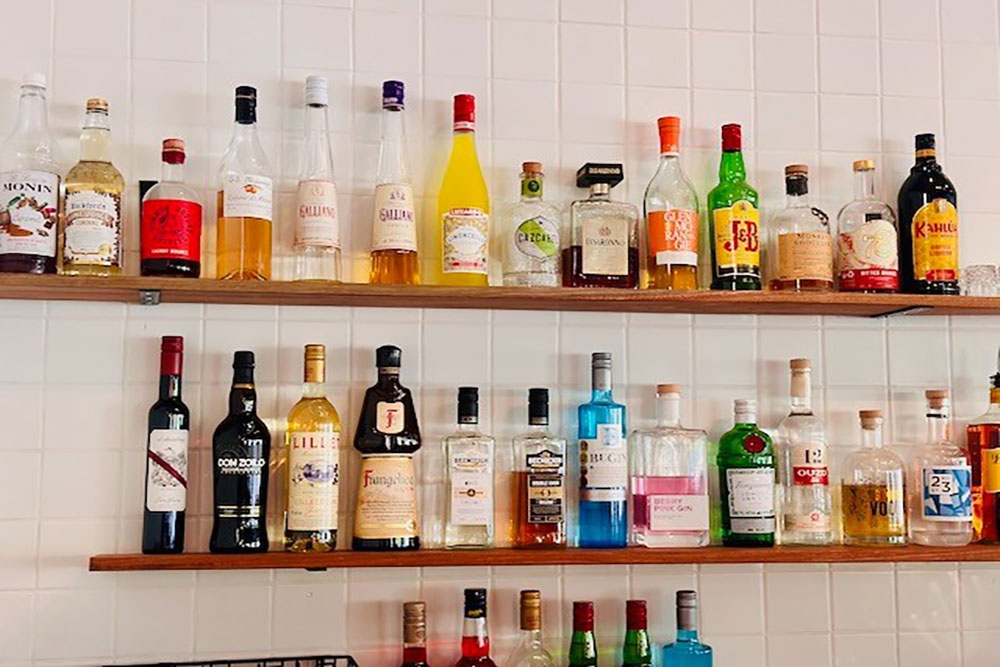 Drinks bottles on wall at Trenino Trattoria