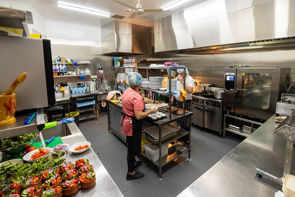 Chefs cooking inside kitchen The Ukrainian Club Holland Park West