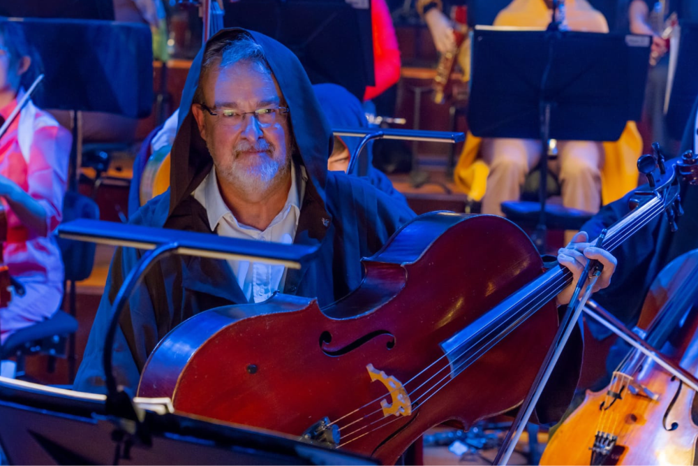 man wearing costume in orchestra performance 
