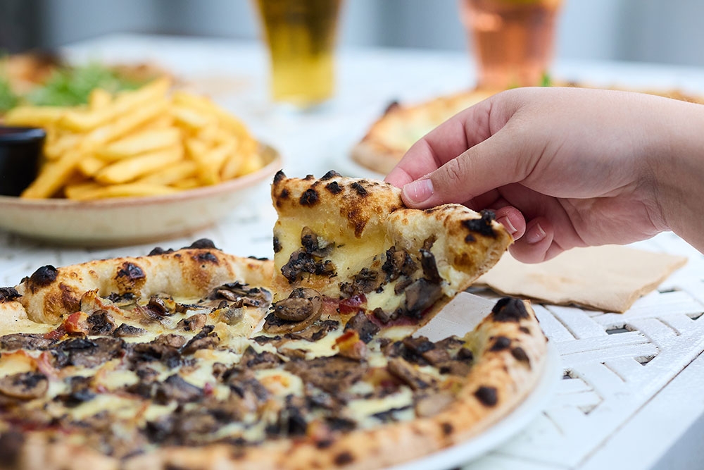 Slice of mushroom pizza at Victoria Park Bistro