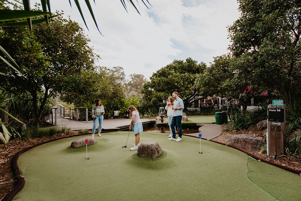 People playing putt putt at Victoria Park Bistro