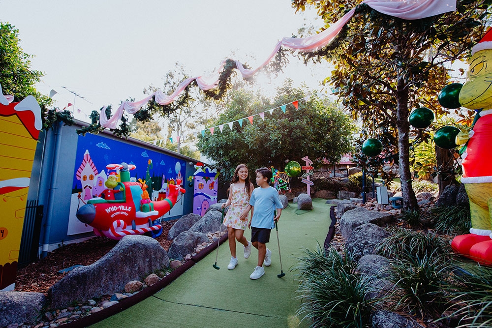 kids playing putt putt Christmas Putt Putt