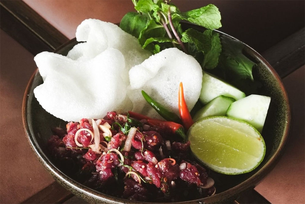 Thai food on a plate at Vela Kinn West End