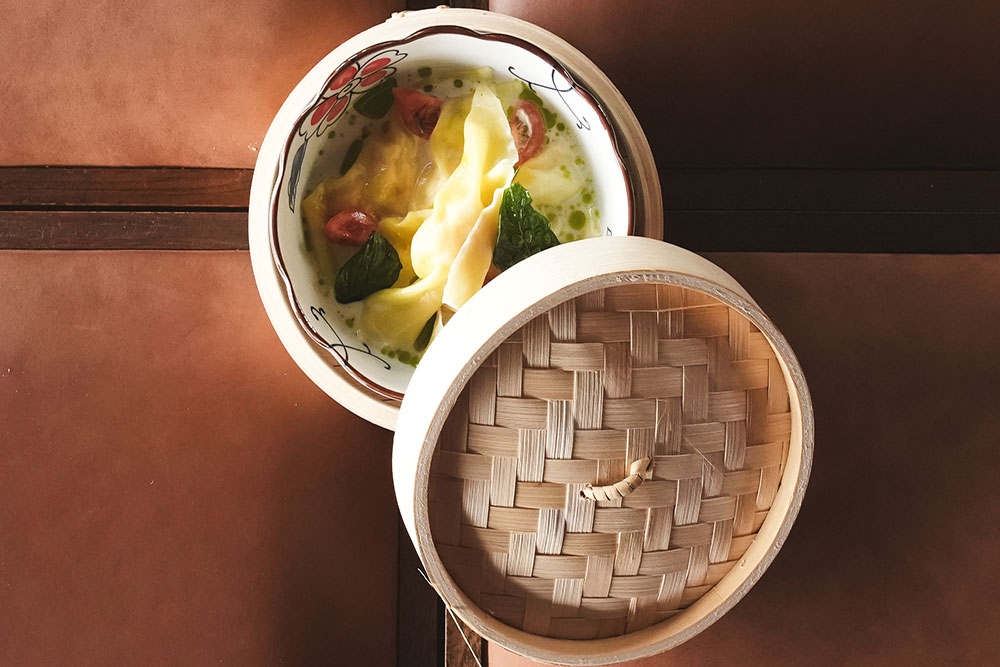Steamed dumplings in a broth at Vela Kinn West End