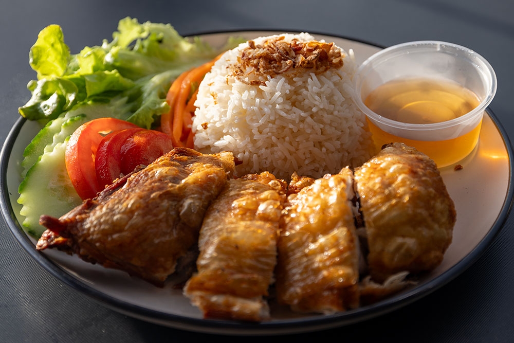 Crispy meat with rice and salad on a plate at Vietnam House Milton