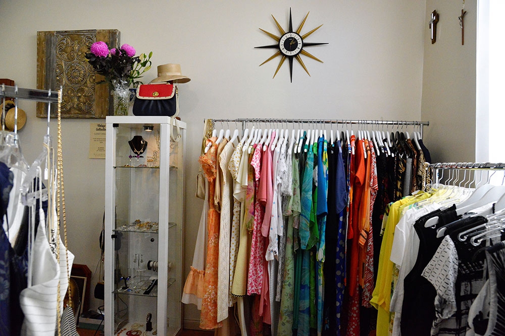 Racks of secondhand garments for sale at Vintage Collective Annerley