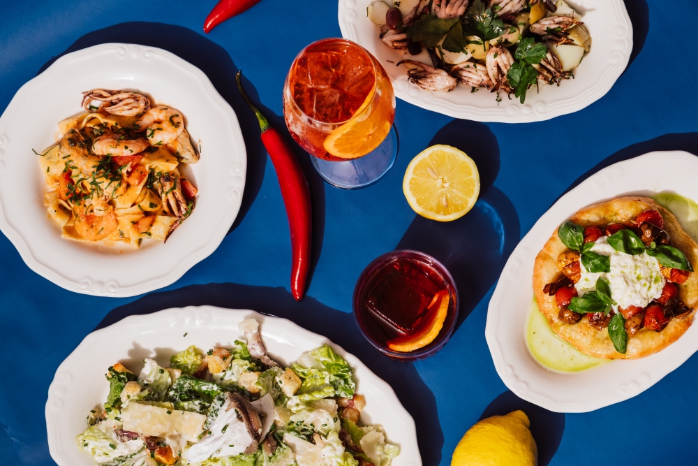 Italian style dishes on a blue table 