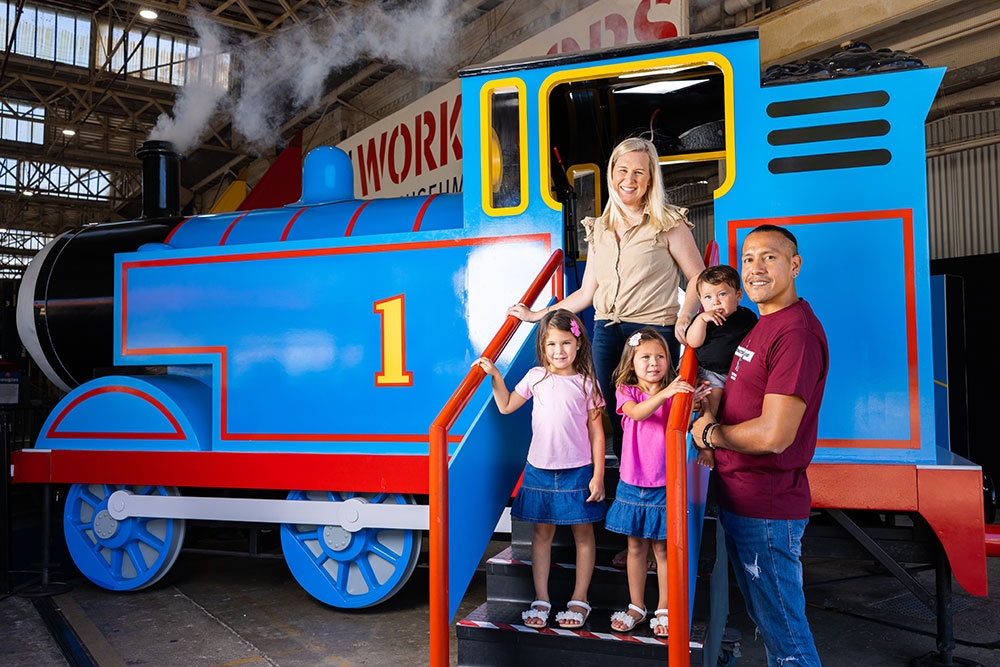 Family infront of Thomas engine Queensland Museum Rail Workshops