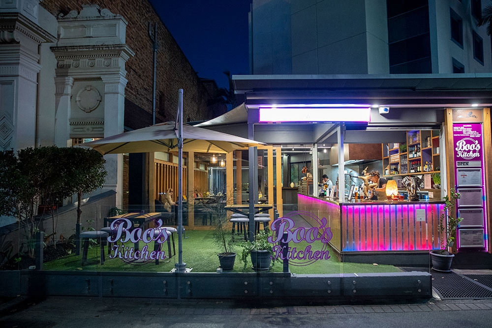 Exterior of Boo's Kitchen, Woolloongabba lit at night
