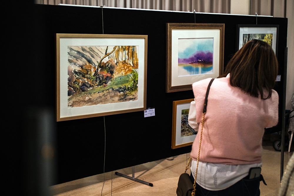Woman looking at art