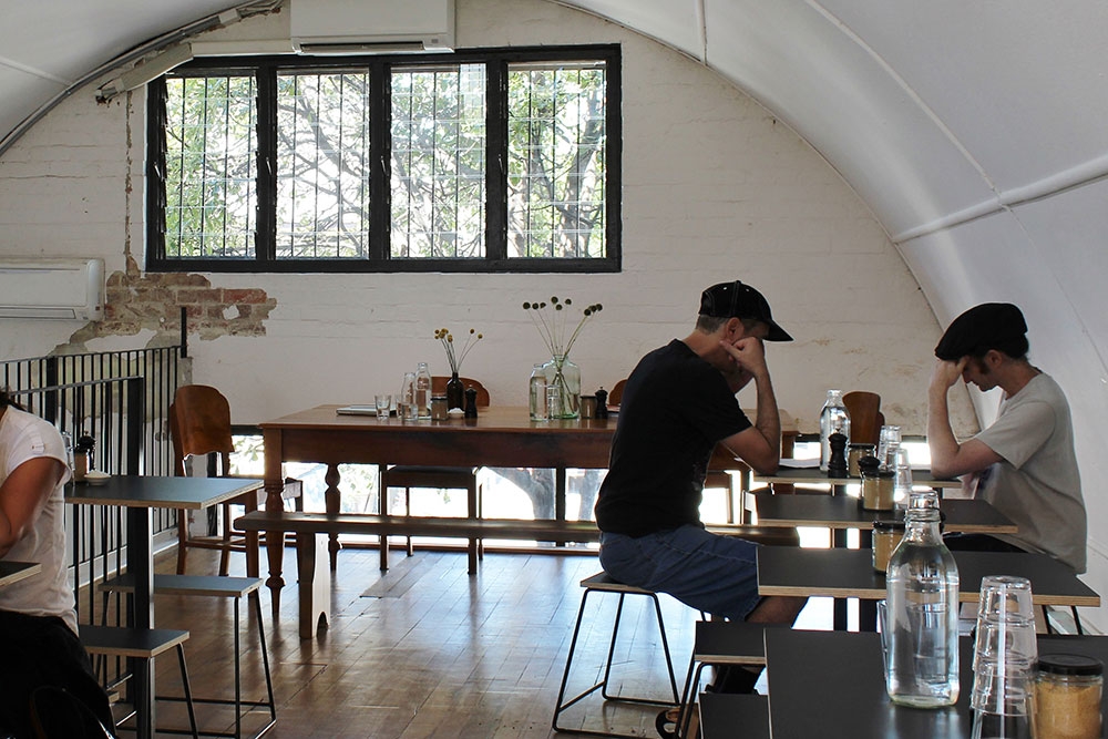 People sitting at tables inside King Arthur Cafe Fortitude Valley