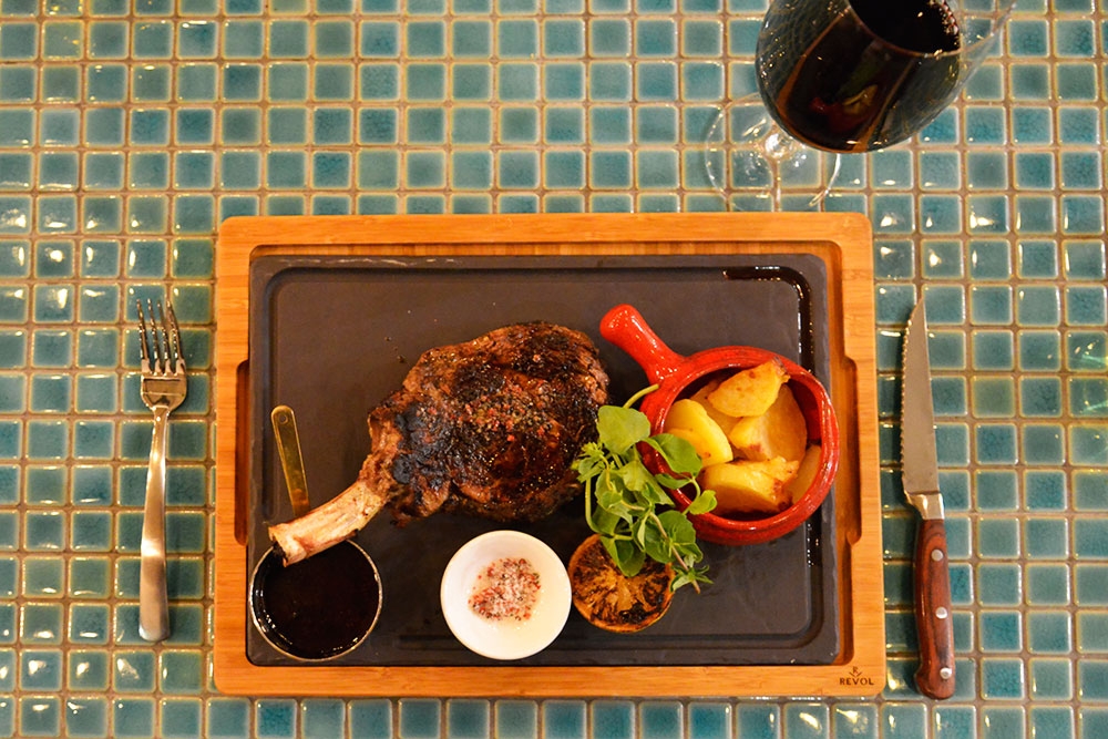 Chicken Breast on the bone, with sweet potato and peas mousseline on a plate at Six Acres Restaurant Bowen Hills