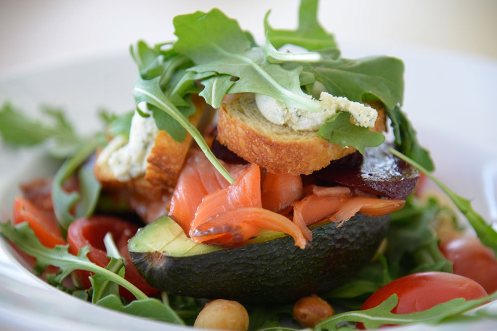House Smoked Huon Salmon served in half avocadoes with roasted macadamia nuts, goats cheese and baked beetroot