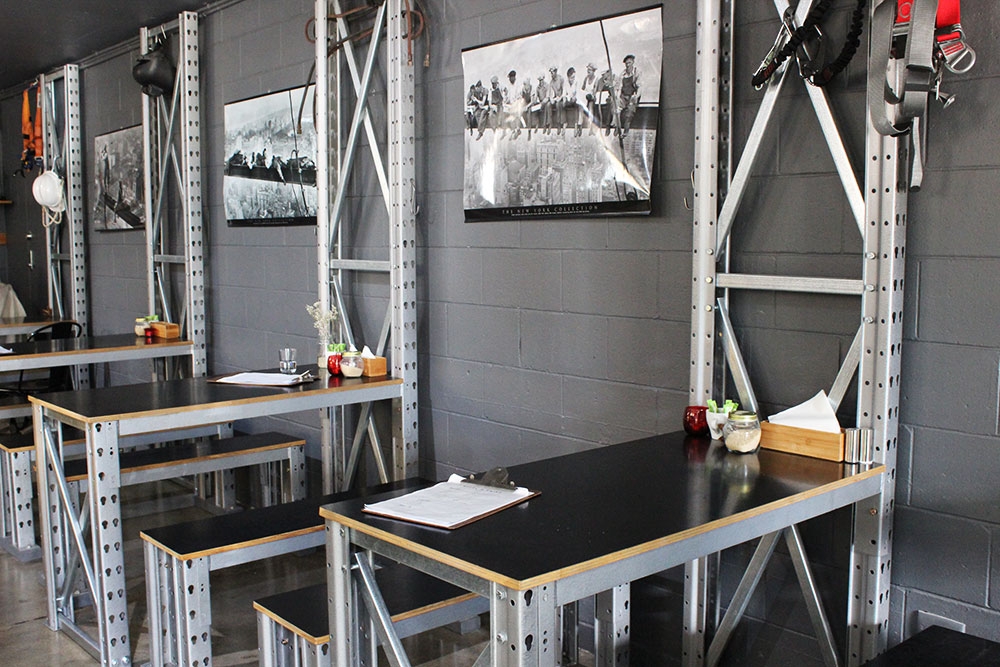 Industrial style tables and chairs inside Steel & Grind Mt Gravatt