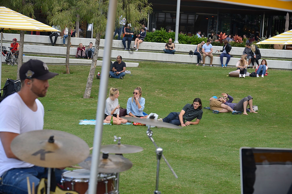 People lying on the grass at the Sunday Sessions on the Green