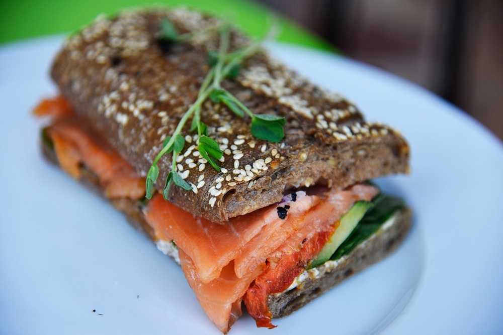 Smoked salmon sandwich on a plate at Under The Clock South Brisbane