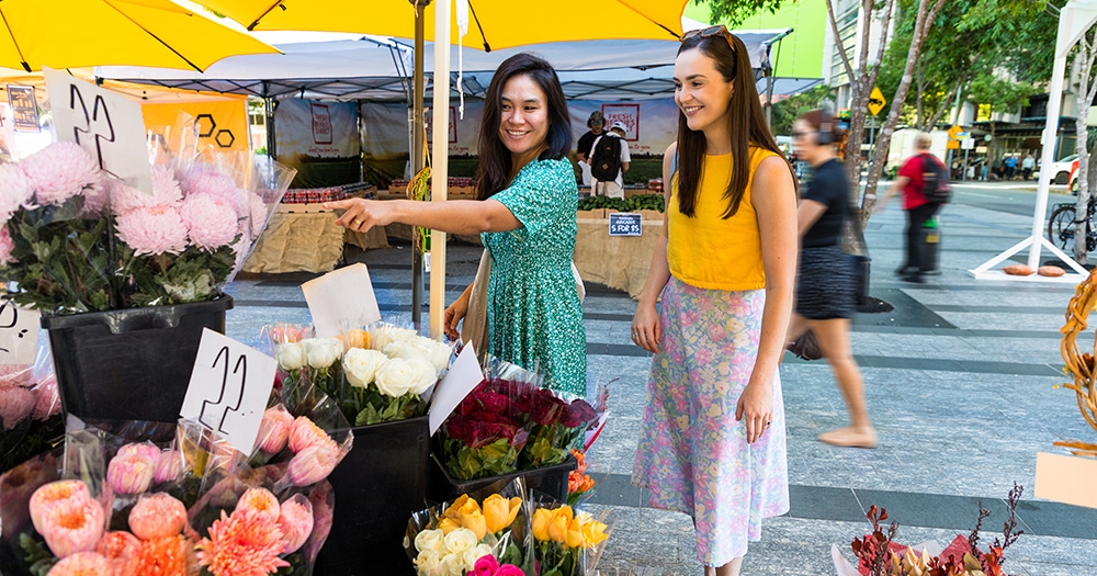 people at market stall
